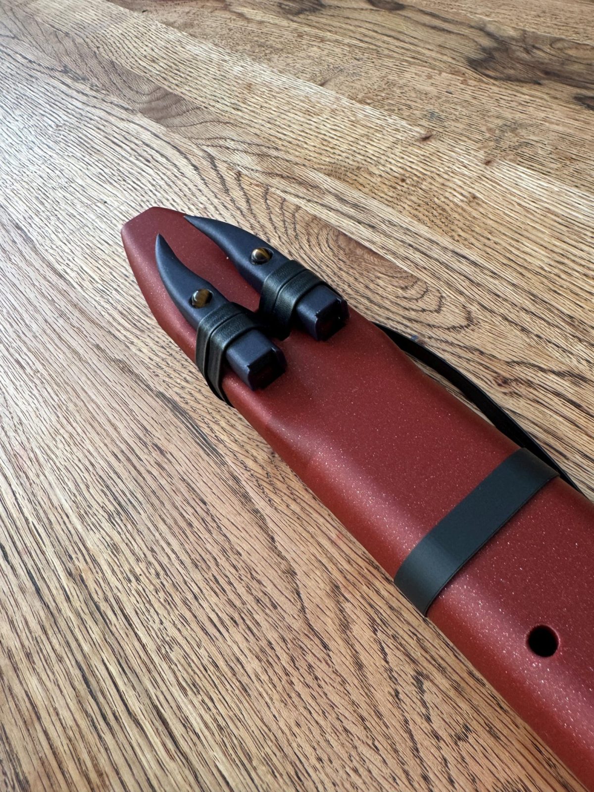 Detail of the twin drone holes and leather ties