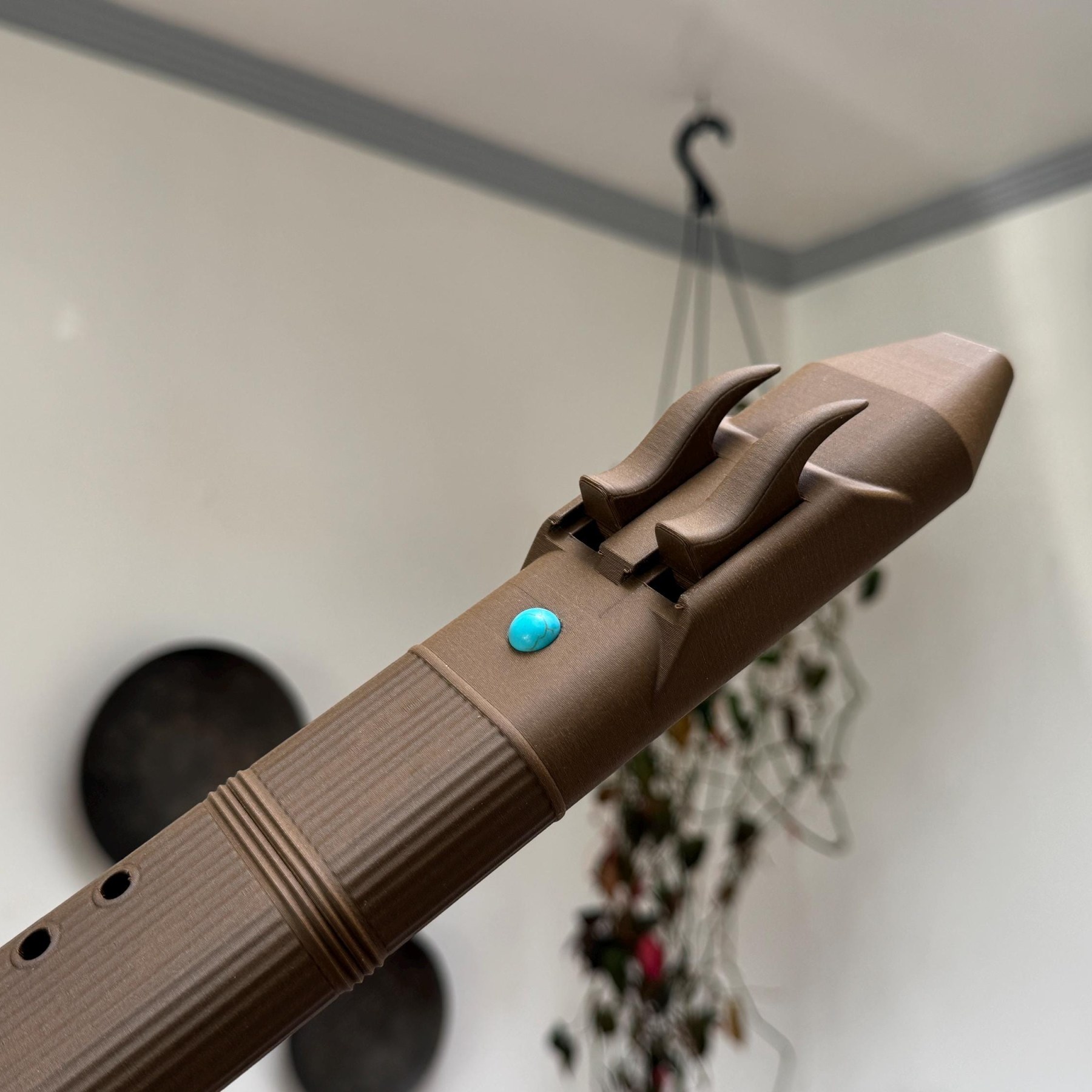 Drone flute mouthpiece blocks seen from an angle with the ridged body below